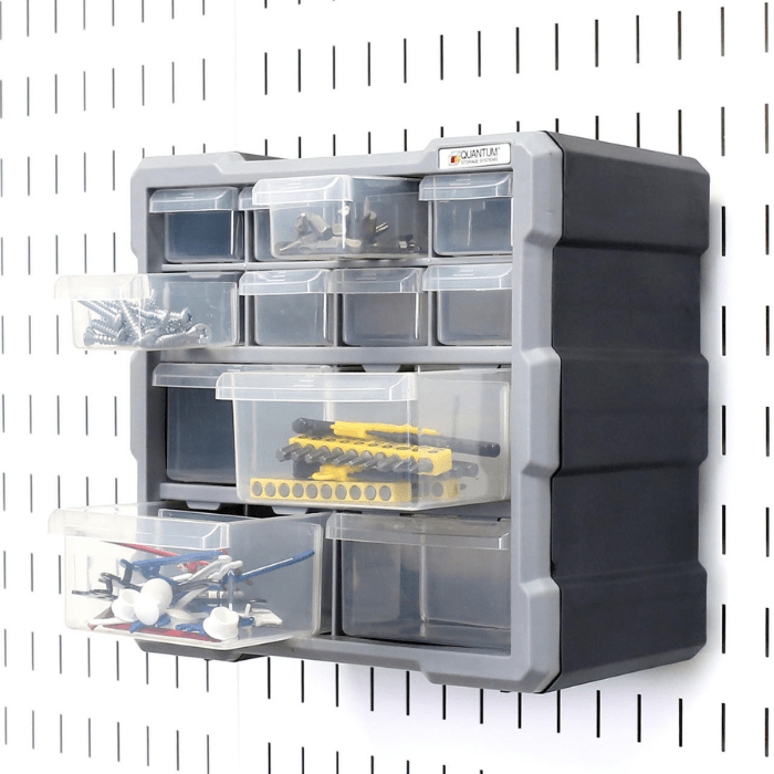the Pegboard 12-Drawer Bin Cabinet with 4 bins pulled our with supplies inside