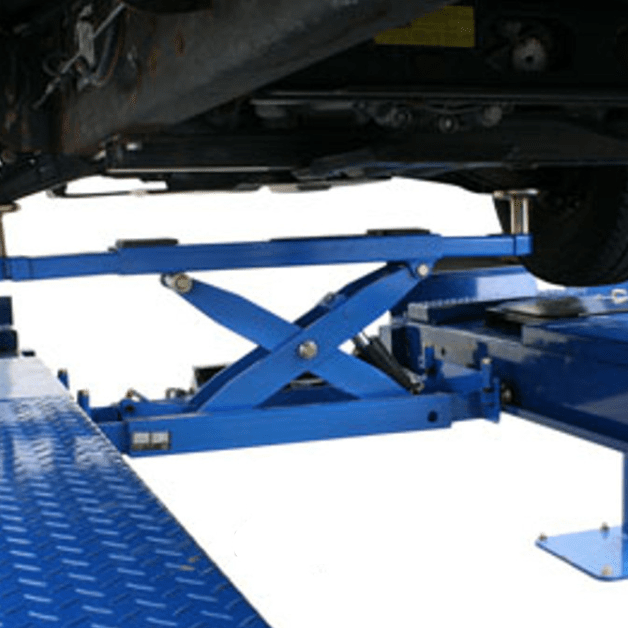 Automotive rolling bridge jack attached to a 4-post lift platform for wheels-off service and undercar access.