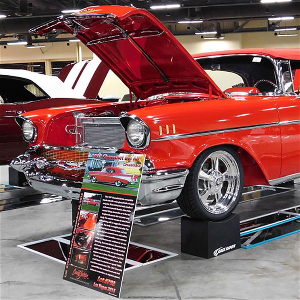 Show car on Race Ramps 12 inch wheel cribs at an indoor event