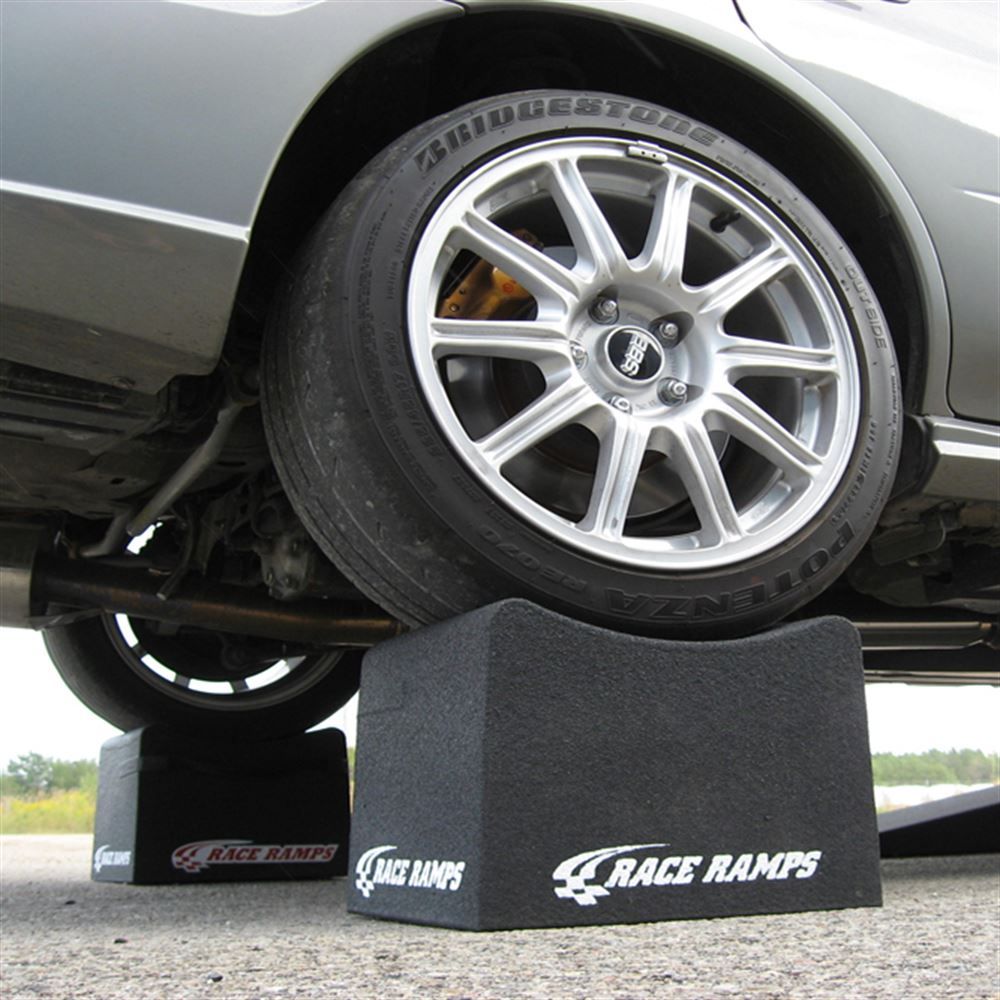 Wide performance tire seated in a Race Ramps 8 inch wheel crib