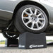Wide performance tire seated in a Race Ramps 8 inch wheel crib
