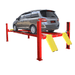 AMGO PRO-14 four post lift shown holding a minivan with red columns, runway platform, and yellow approach ramps