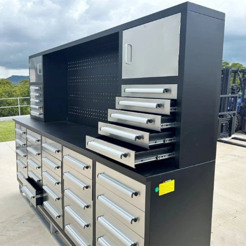 Angled outdoor view of Chery Industrial 10 foot tool storage workbench cabinet with multiple drawers extended for access