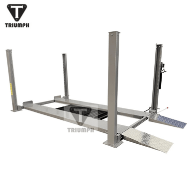 Angled side view of the Triumph NSS-8XLT Four-Post Vehicle Lift with extended columns and approach ramps.