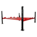 Angled side view of the Triumph NSS9000 Four-Post Double Parking Vehicle Lift with black columns and red runways.