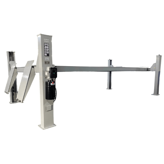 Angled side view of the Triumph NTR-32 Vehicle Lift, showcasing tall steel columns, diamond-plate runways, and a powerful hydraulic motor for heavy-duty lifting.
