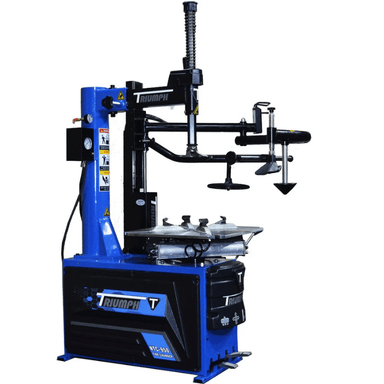Angled view of the Triumph NTC-950-1 High-Capacity Tire Changer with a pneumatic assist arm, foot pedal controls, and a robust turntable for demanding tire servicing tasks.