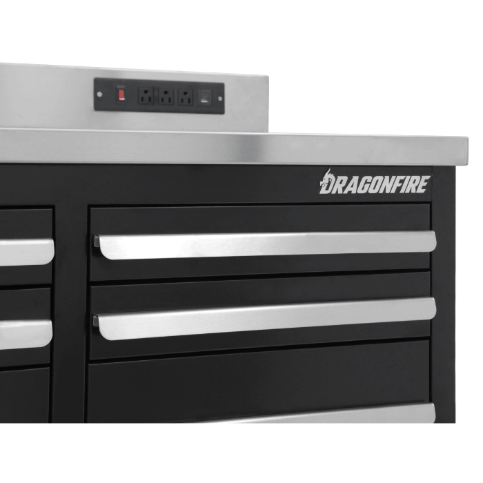 Close-up of Dragonfire logo, drawer handles, and integrated power outlets on the black Pro Series 7ft workbench (DFT-WB-17)