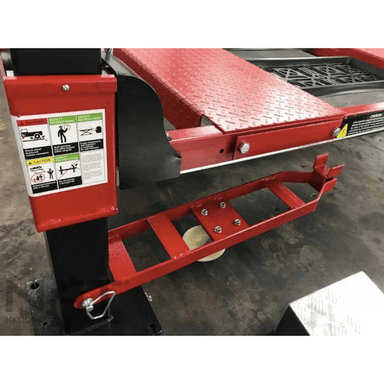 Close-up of the Triumph NOS9000XLT Four-Post Vehicle Lift’s caster bracket attached to a red runway and black support column for easy mobility.