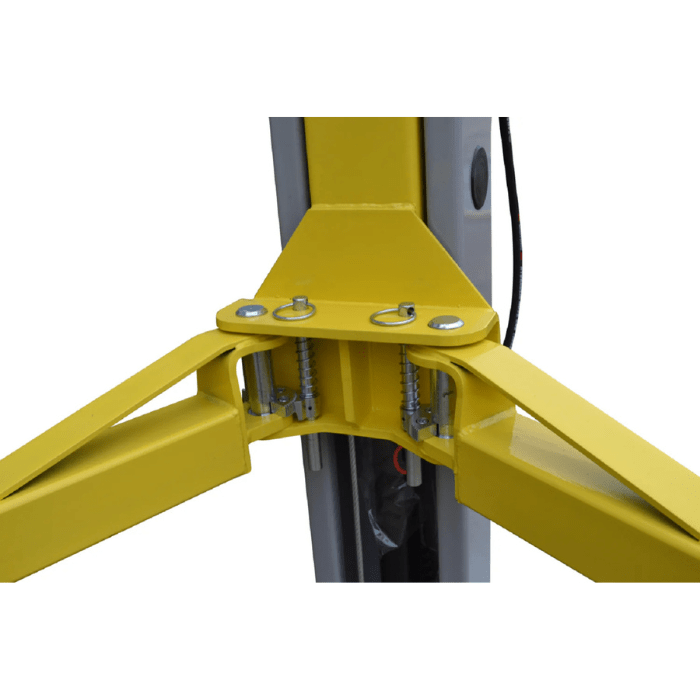Close-up of the Triumph NT-9 lift arm connection point with locking pins and spring-loaded mechanisms