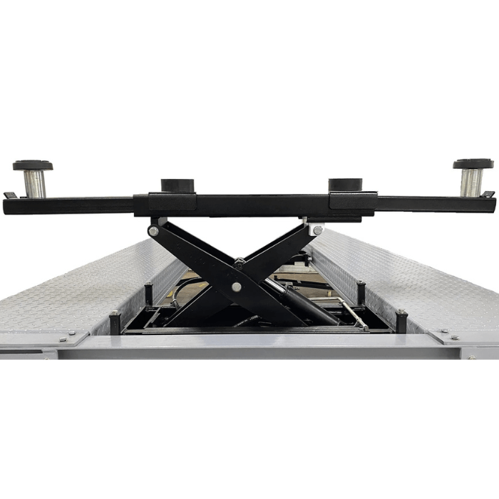 Close-up of the Triumph RJ-5000 Bridge Jack mounted on a four-post lift, featuring adjustable lift pads and a sturdy scissor mechanism for reliable vehicle support.