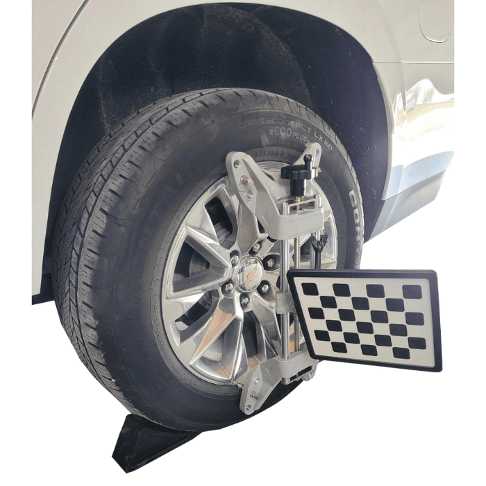 Close-up of wheel clamp and target on SUV tire for iDEAL 3D wheel alignment system