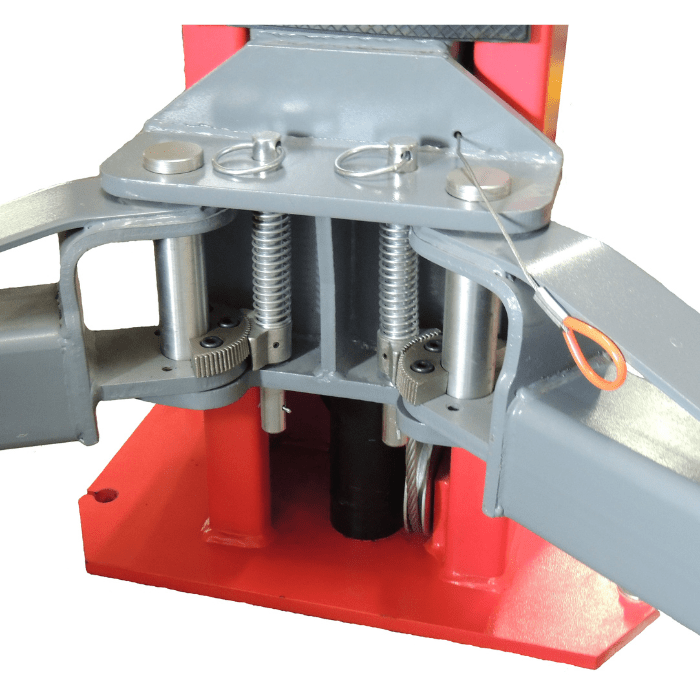 Detailed view of the dual-point lock release mechanism on the Launch Symmetric 2 Post Floor Lift – 9,000 lb - TLT240SB-R, showing internal gearing and tension cables at the base of the column.