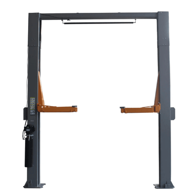 Direct front view of the Triumph NTO-20S Two-Post Vehicle Lift with twin gray columns, orange arms in raised position, and a top-mounted bar designed for overhead cable routing.
