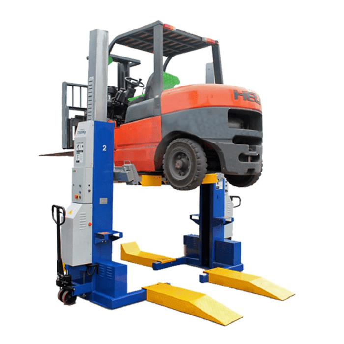 Forklift raised on MSC mobile column lifts using MSC-FORKSPACER adapter ramps.