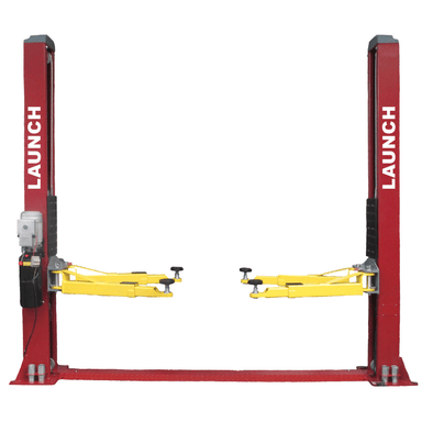 Front view of the Launch Two Post Car Lift - 9,000 lb Capacity, Symmetric Floor Plate - TLT240SB-R, showing the red columns and yellow lifting arms fully extended.
