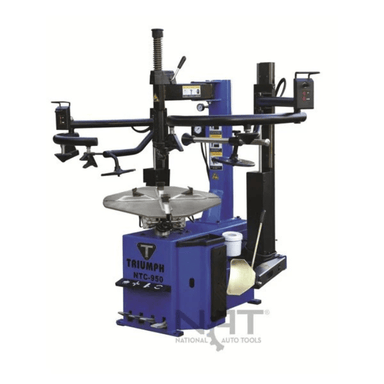 Front view of the Triumph NTC-950-2 Tire Changer featuring dual assist arms, foot pedal controls, and a heavy-duty turntable for efficient tire servicing.