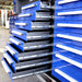 Full extension blue drawers on Chery Industrial 10ft 35 drawer workbench opened in workshop