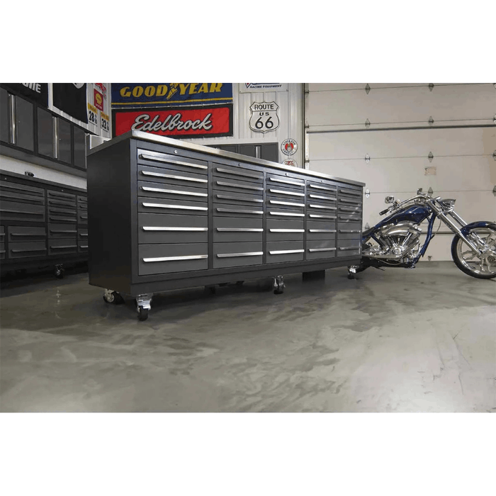 Lifestyle photo of Dragonfire gray 30 drawer 9 foot workbench with stainless top model DFT-WB-30