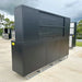 Outdoor staging photo of Chery Industrial 10 foot tool storage workbench cabinet showing rear side of the hutch and base