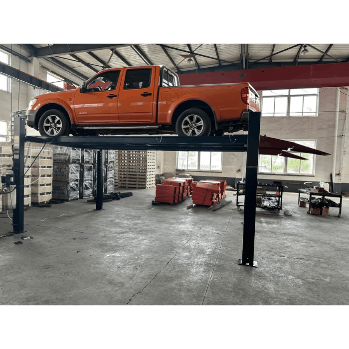 Pickup truck raised on the Katool KT-4M110PA 11,000 lb 4-post lift