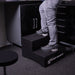 Technician standing on a Race Ramps two step to reach a tool cabinet