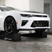 Camaro raised on Race Ramps 80 inch combo ramps in a garage