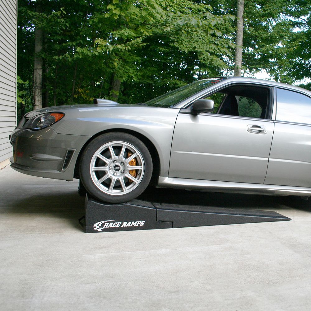Subaru driven up onto Race Ramps 80 inch combo ramps