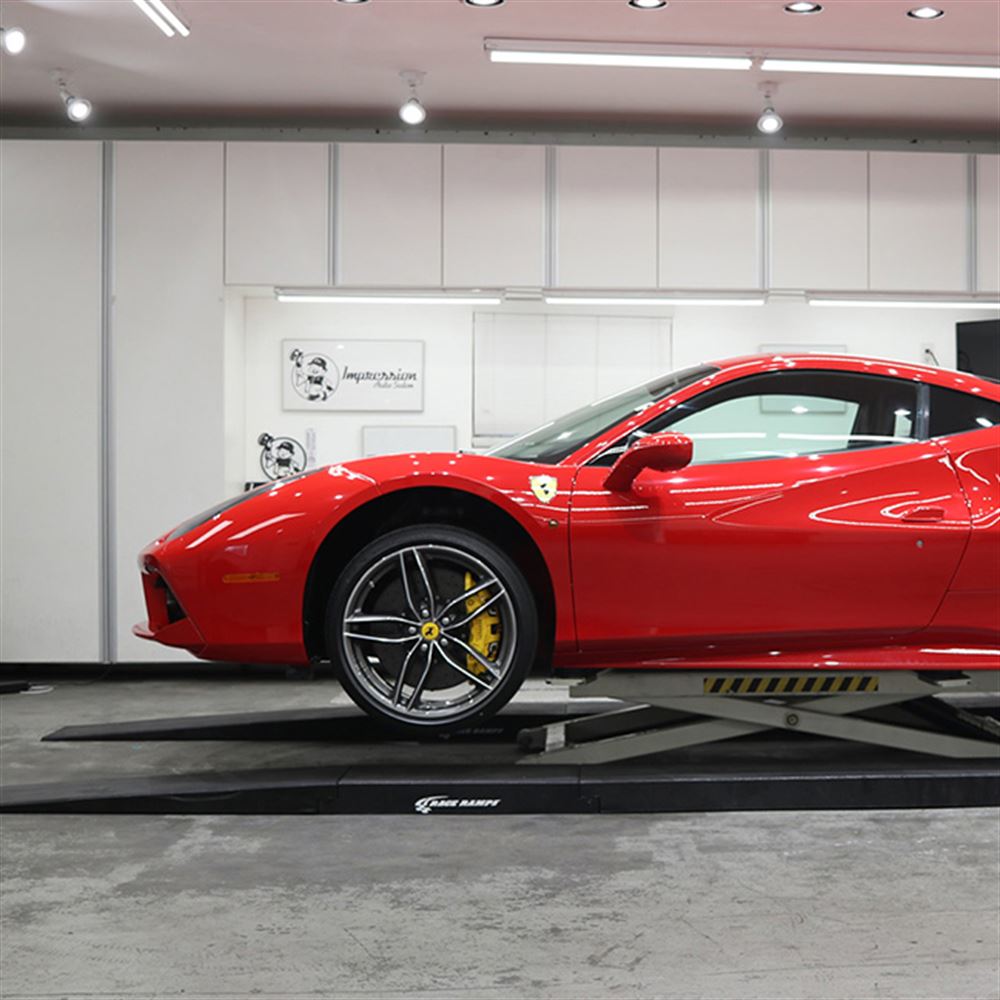 Ferrari driven onto Race Ramps 4 inch car lift ramps