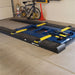 Race Ramps car lift ramps leading onto a scissor lift in a garage
