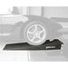 Corvette front wheel driving onto a Race Ramps lip nose rack ramp