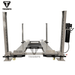 Rear approach of the Triumph 8,000 lb Four Post Automotive Lift – Service Storage (NSS-8), highlighting four steel columns, diamond-plate runways, and a side-mounted hydraulic power unit for dependable vehicle lifting.