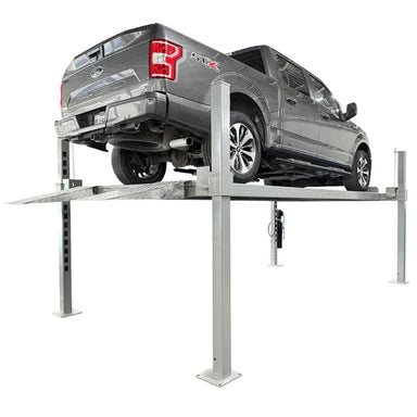 Rear three-quarter view of truck on Triumph NOS10000 four-post vehicle storage lift 10K with ramp visible
