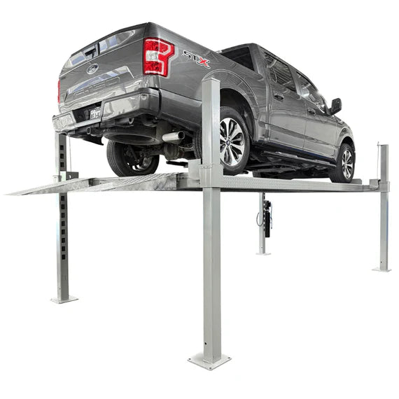 Rear three-quarter view of truck on Triumph NOS10000 four-post vehicle storage lift 10K with ramp visible
