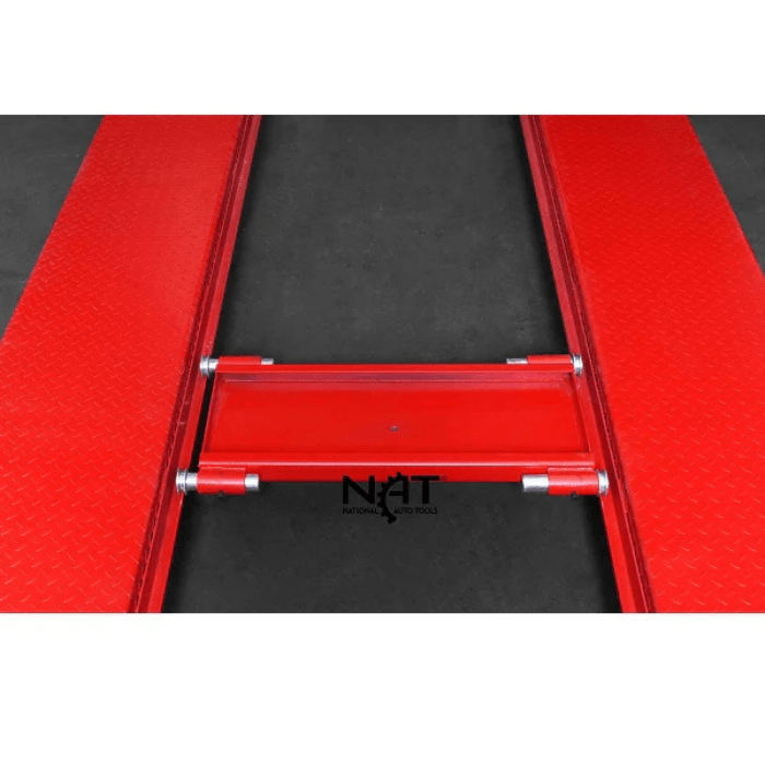 Red steel jack tray positioned between the runways of the Triumph NOS9000XLT Four-Post Lift.