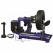 Side view of the Triumph NTC-650 Wheel Changer handling a heavy truck tire, featuring robust clamp arms and a powerful rotating assembly for large-scale tire service.