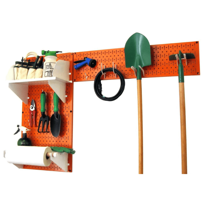 The Pegboard Garden Tool Board Organizer Kit by Wall Control with an orange pegboard and white accessories with tools