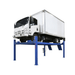 The Atlas PVL14 14,000 lb. 4-post lift is shown lifting a commercial truck with ease—built for shops that need serious strength and reliable clearance for heavy-duty service work.