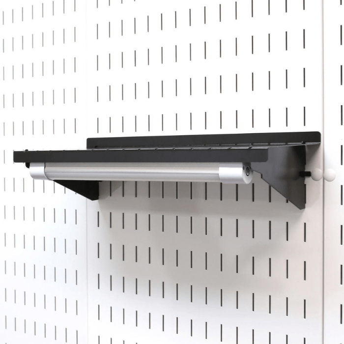 The Magnetic LED Light Bar for the Master Pegboard Workbench Kit mounted to a shelf