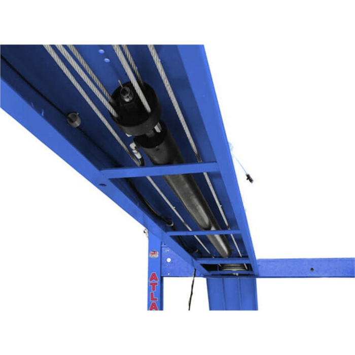Underside view of the Atlas PVL14 4-post lift showcases its heavy-duty cylinder and cable routing—engineered for smooth, balanced lifting.