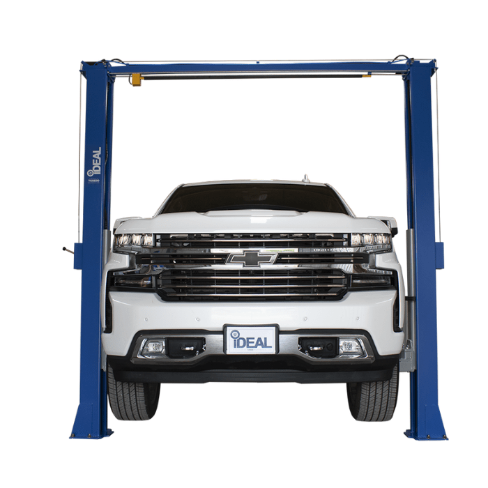 White Chevy Silverado positioned on iDEAL TP10KAC-DX 2 post car lift