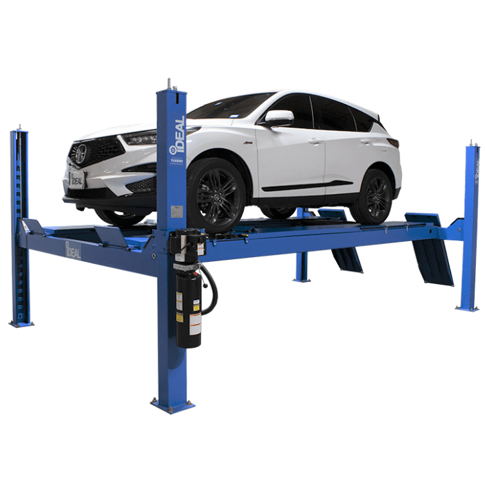 White SUV lifted on iDEAL FP14KAC-X 14,000 lb 4 post alignment lift