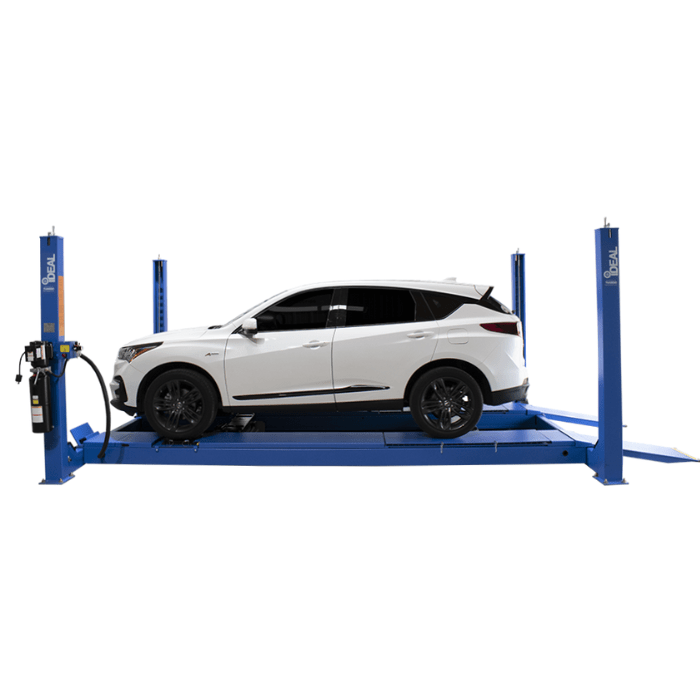 White SUV positioned on a blue iDEAL FP14KAC-X 4-post alignment lift.