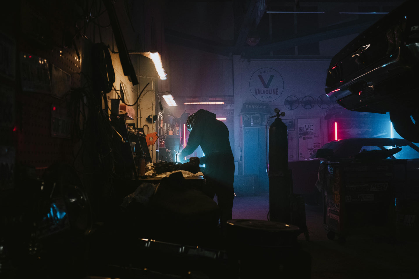 Inside an American automotive workshop with hydraulic car lifts