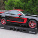 Mustang elevated on Portable Pit Stop Ramps for underbody access