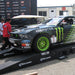 Race car displayed on Portable Pit Stop Ramps at a trade show