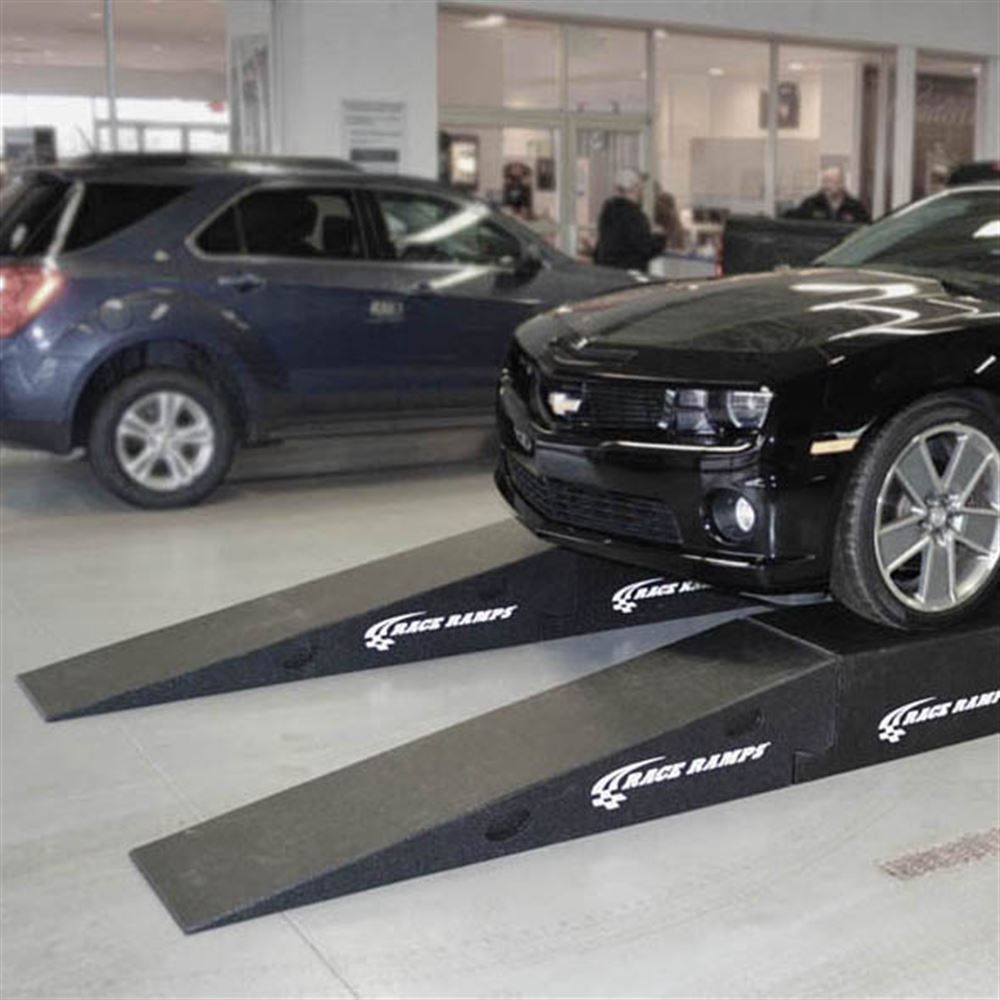 Camaro raised on Race Ramps Restyler Ramps in a shop