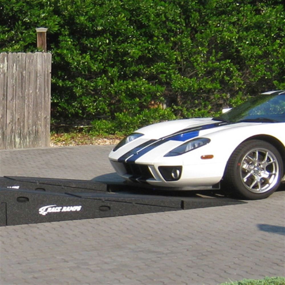 Low supercar driving up Race Ramps XTenders onto Restyler Ramps