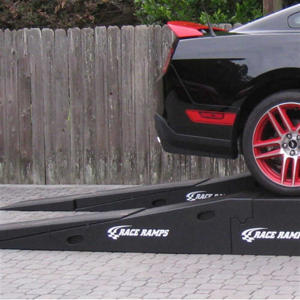 Rear of a Mustang climbing Race Ramps XTenders onto Restyler Ramps