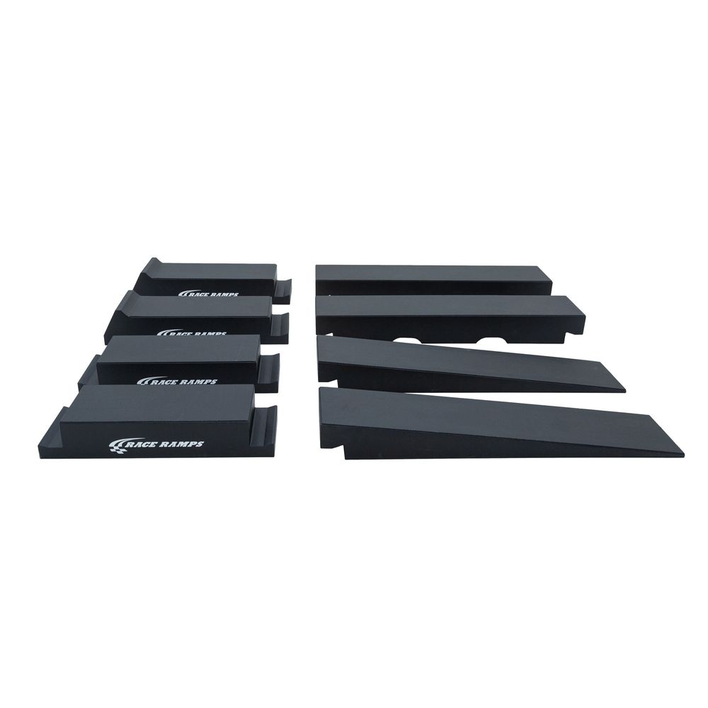 All eight interlocking pieces of the Race Ramps Portable Pro Lift Ramp set